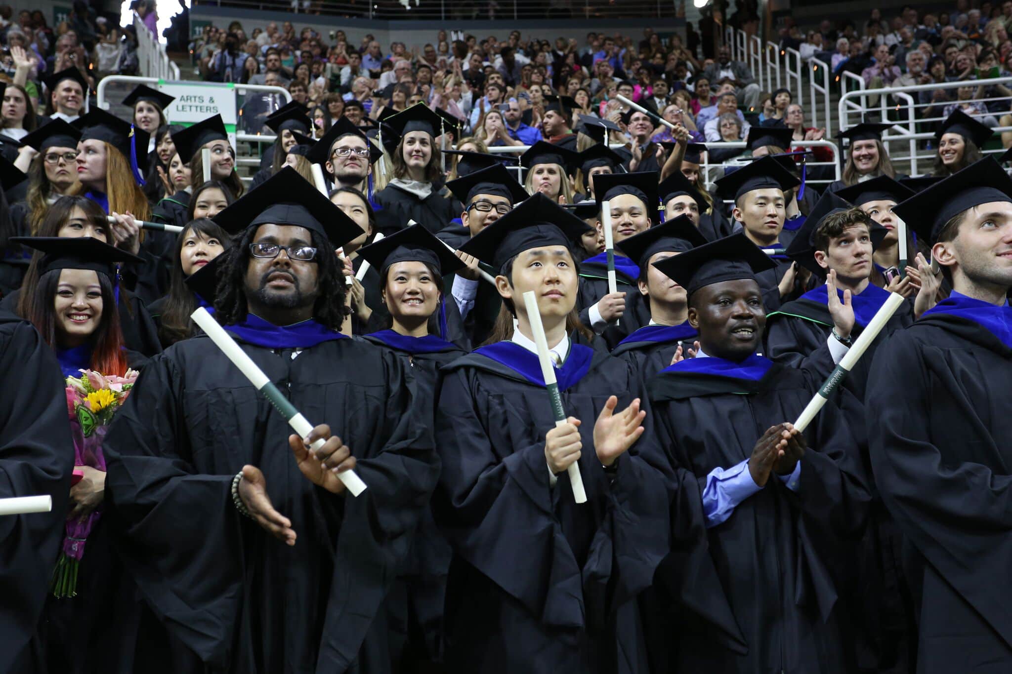 Recent doctorate graduates at graduation ceremony.