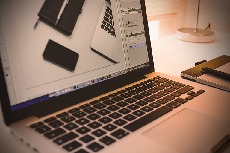 Image of an open laptop on a desk
